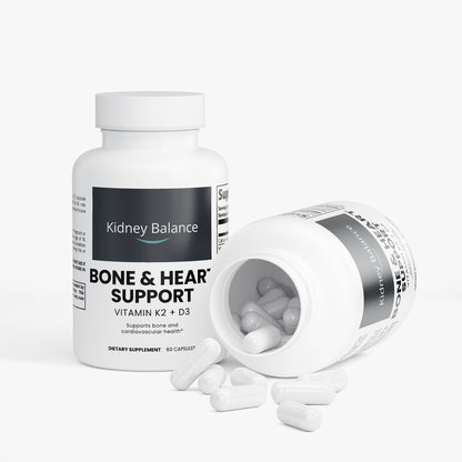 Supplement bottle labeled 'Kidney Balance' with open cap showing capsules on a white background